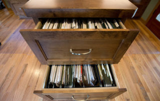 Detail of filing cabinet built into T-shaped desk