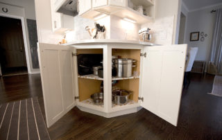 Corner cabinet with doors open, shelves for display