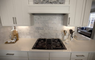 Marble tile, cooktop, cabinetry